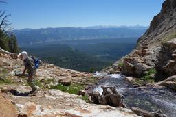 Mohamed at the waterfall, with sawtooth valley and the white clouds [thu jul 2 12:07:48 mdt 2015]